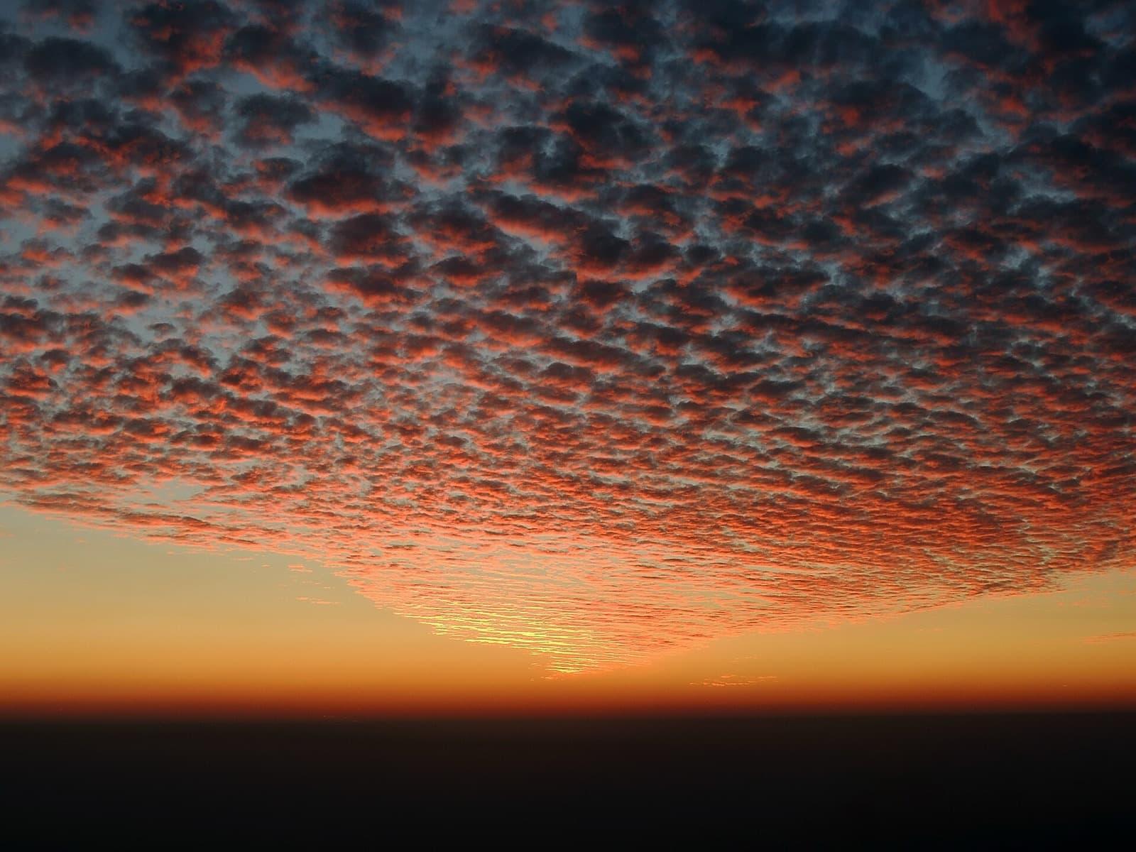 A glowing sunset sky over the hills near Mussoorie and the Doon valley