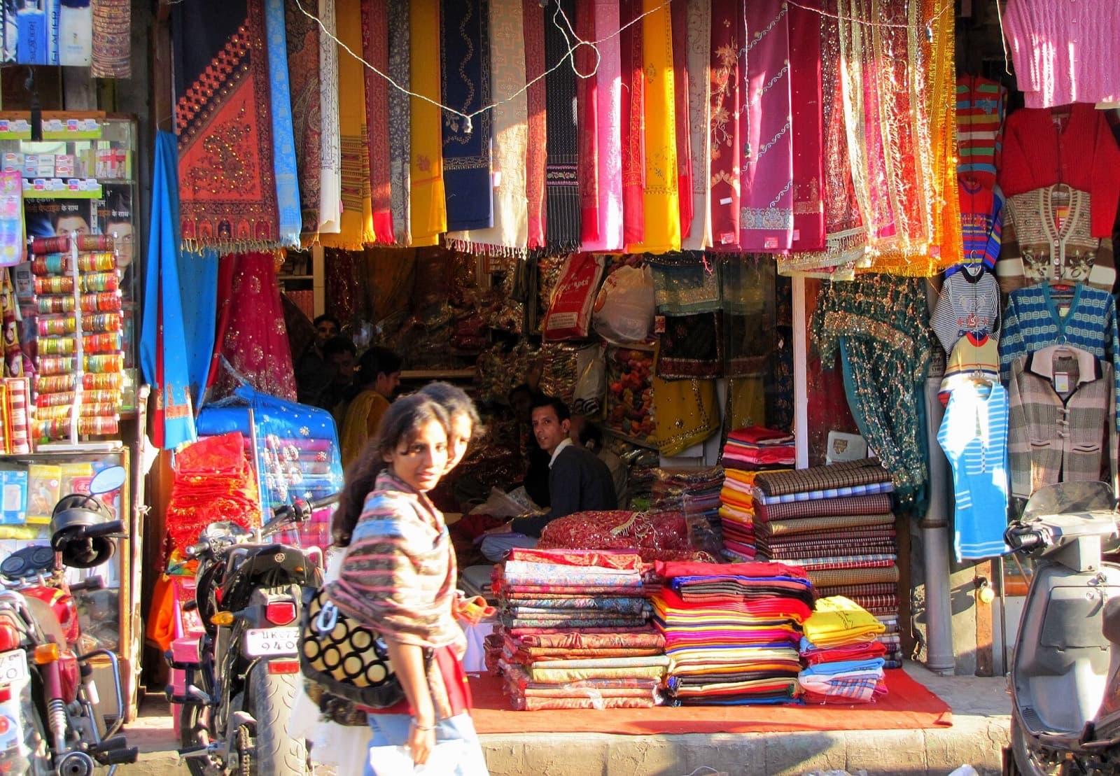 Evening crowds filling the main lane of Paltan Bazaar