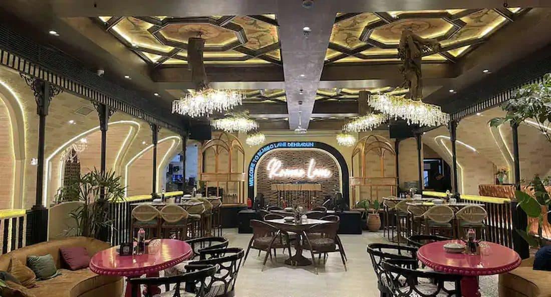 The ornate gold-arched, chandelier-lit interior of Romeo Lane, Dehradun
