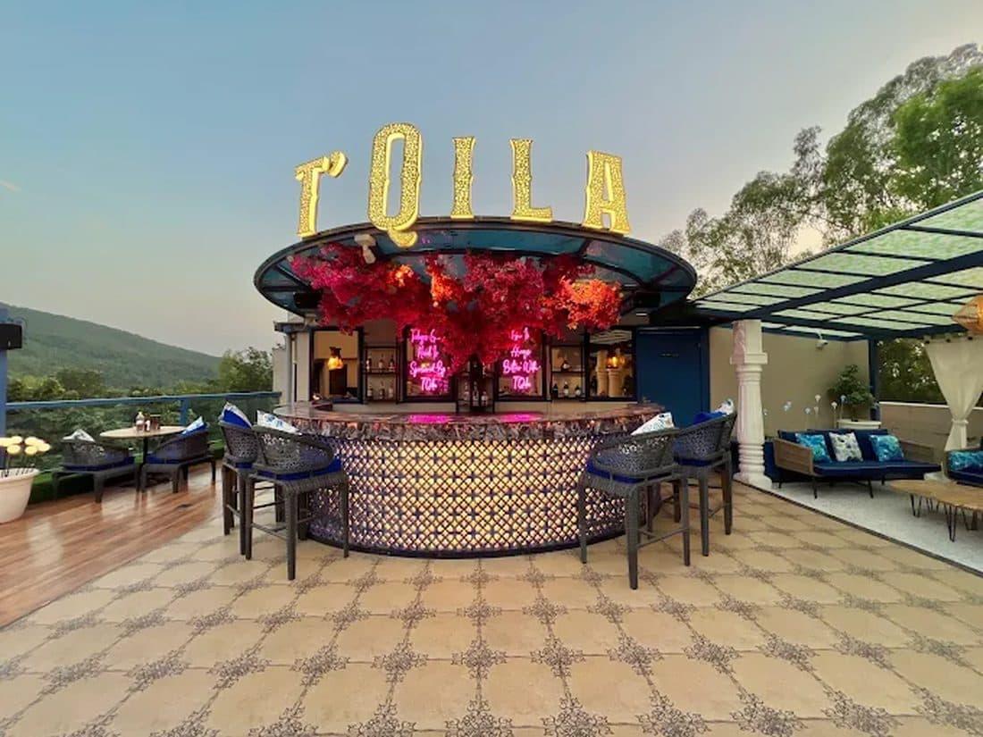 T'Qila lit-up rooftop bar on Mussoorie Road, Dehradun at dusk