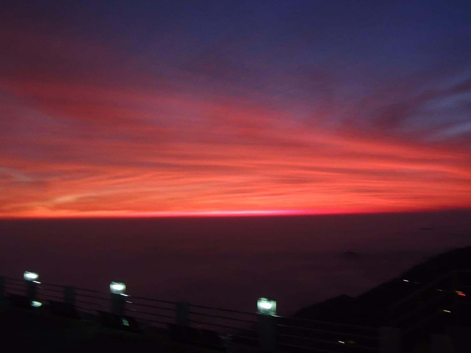 The glowing orange winterline over the Doon valley at dusk, seen from Mussoorie
