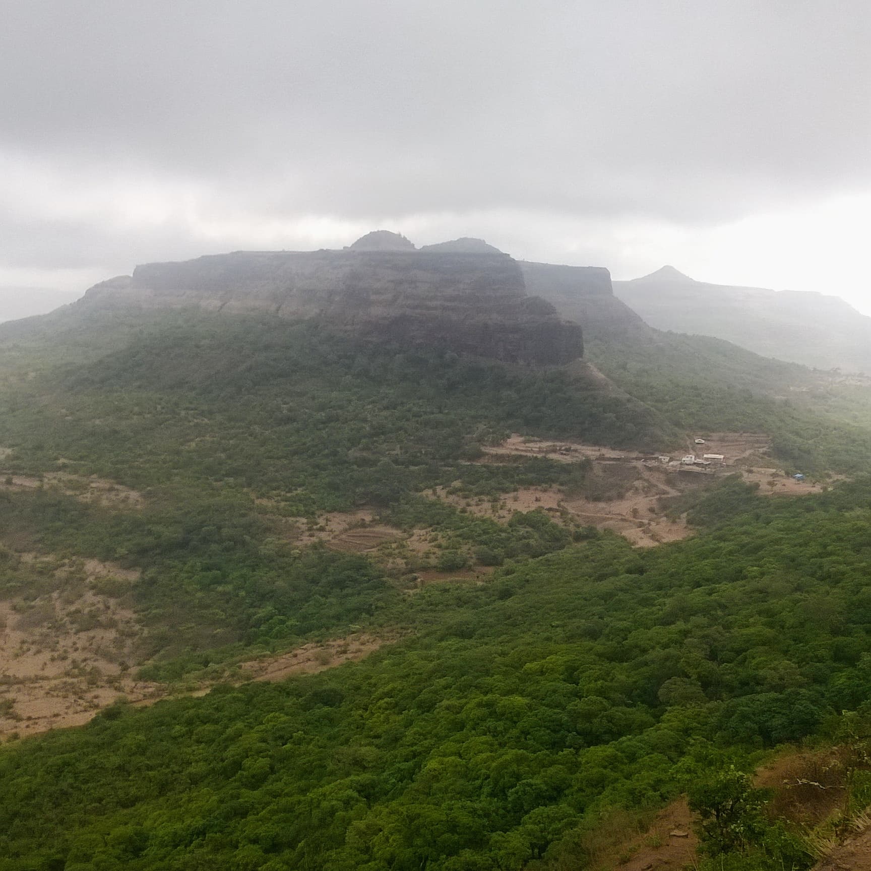Mist and rain over the green hills above Dehradun during the monsoon