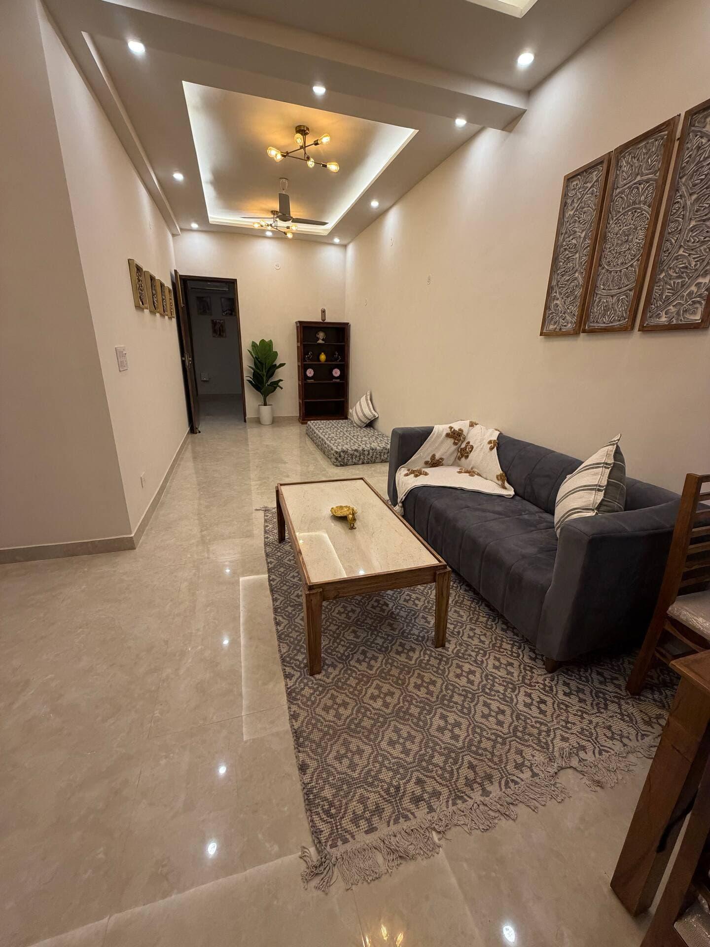 A warm, boho-styled living room in a Starfish homestay in Dehradun