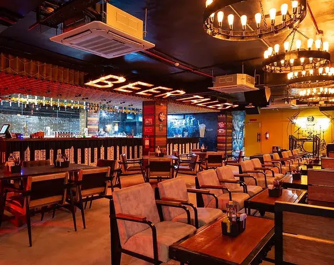 The warm wood-and-brick interior of BeerTales brewery and bar in Dehradun