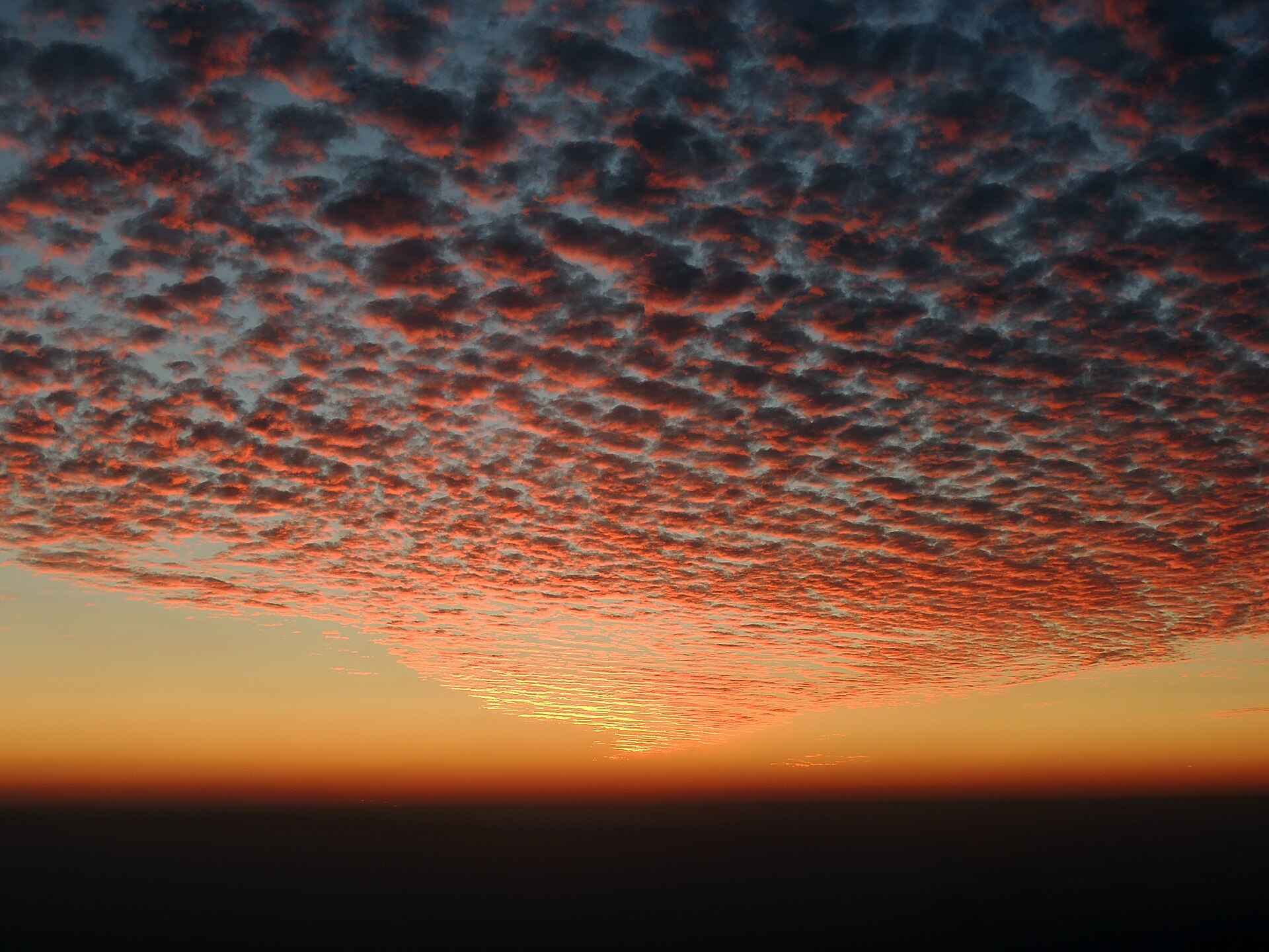 A glowing sunset sky over the hills near Mussoorie and the Doon valley